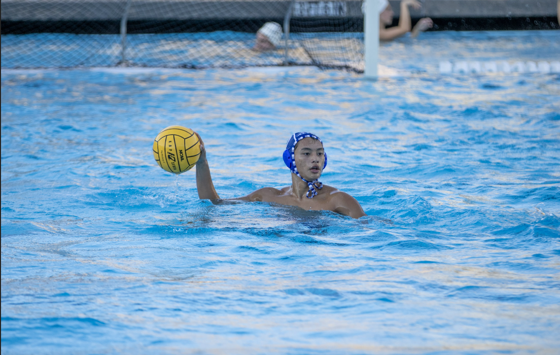 Senior Joseph Tang looks to a teammate for a pass against the Palo Alto Vikings